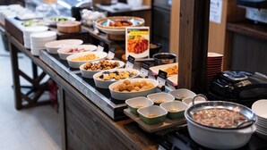 A buffet with various dishes and bowls of food. - APA Hotel Nagasaki Dejima (Nagasaki)
