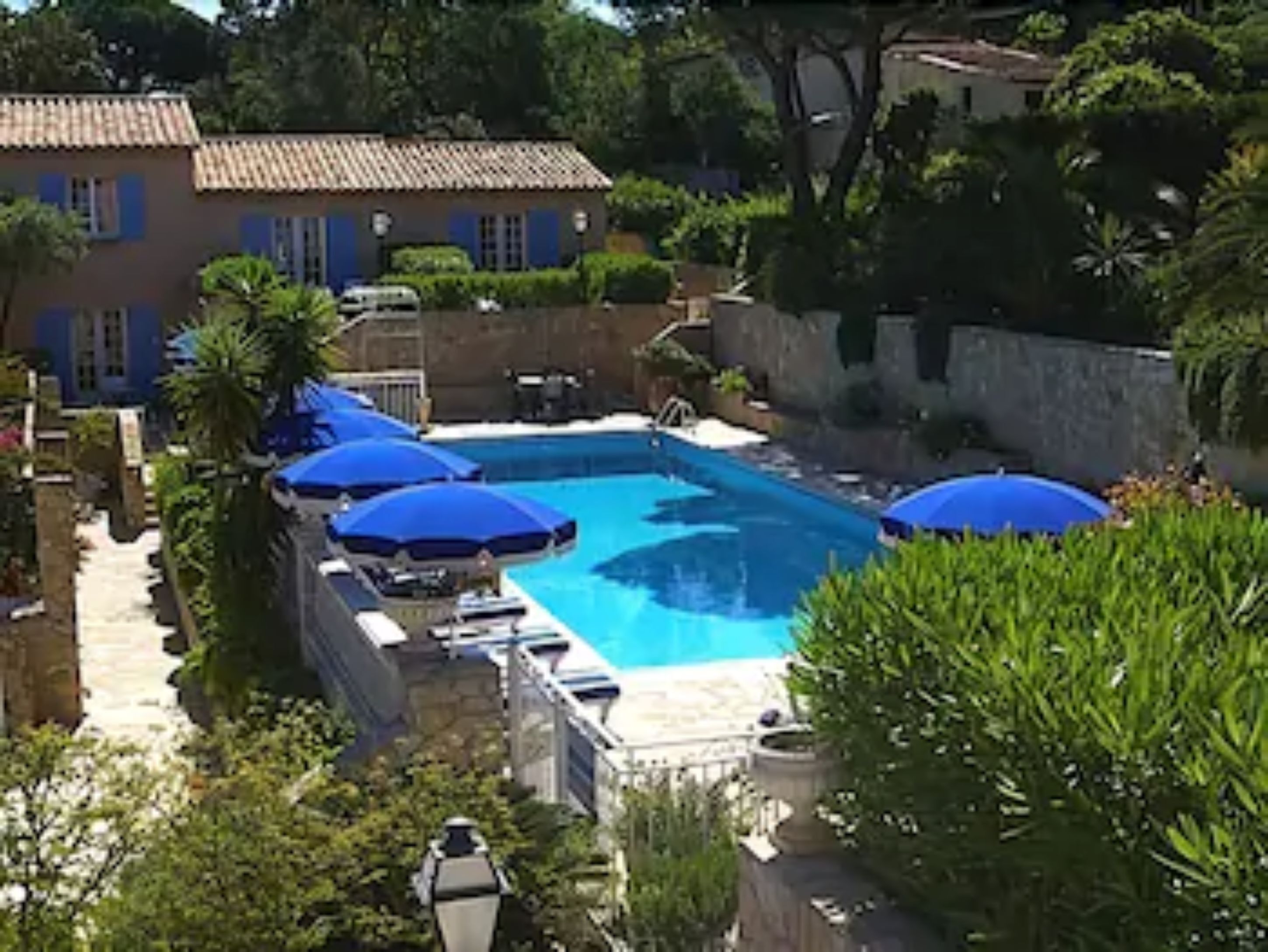 outdoor pool, pool umbrellas, pool loungers