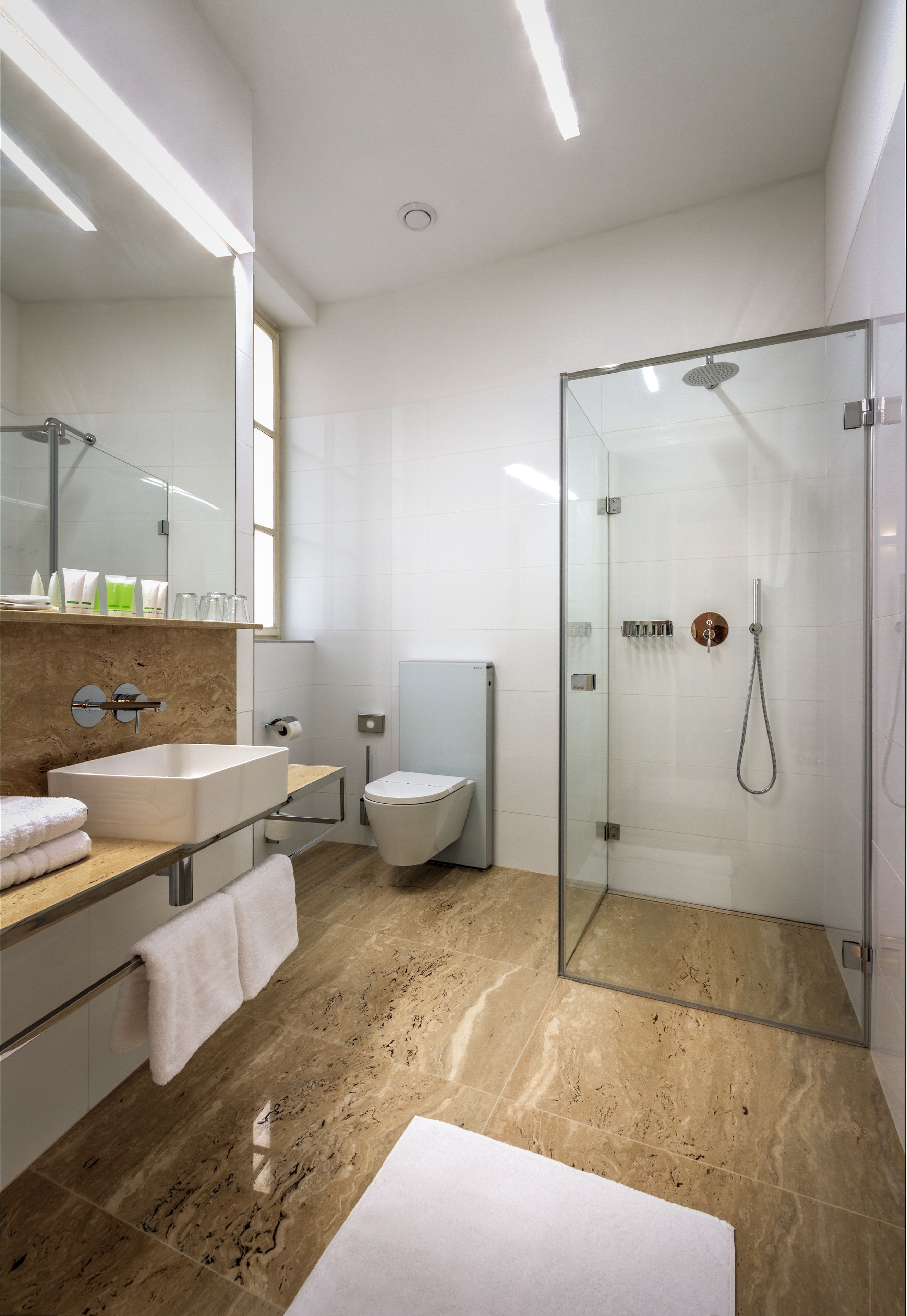 designer toiletries, hair dryer, towels