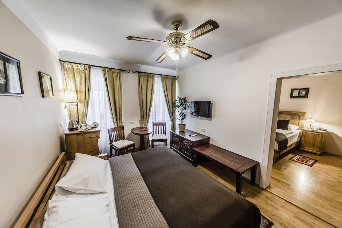 Standard Quadruple Room, River View | In-room safe, desk, iron/ironing board, free WiFi