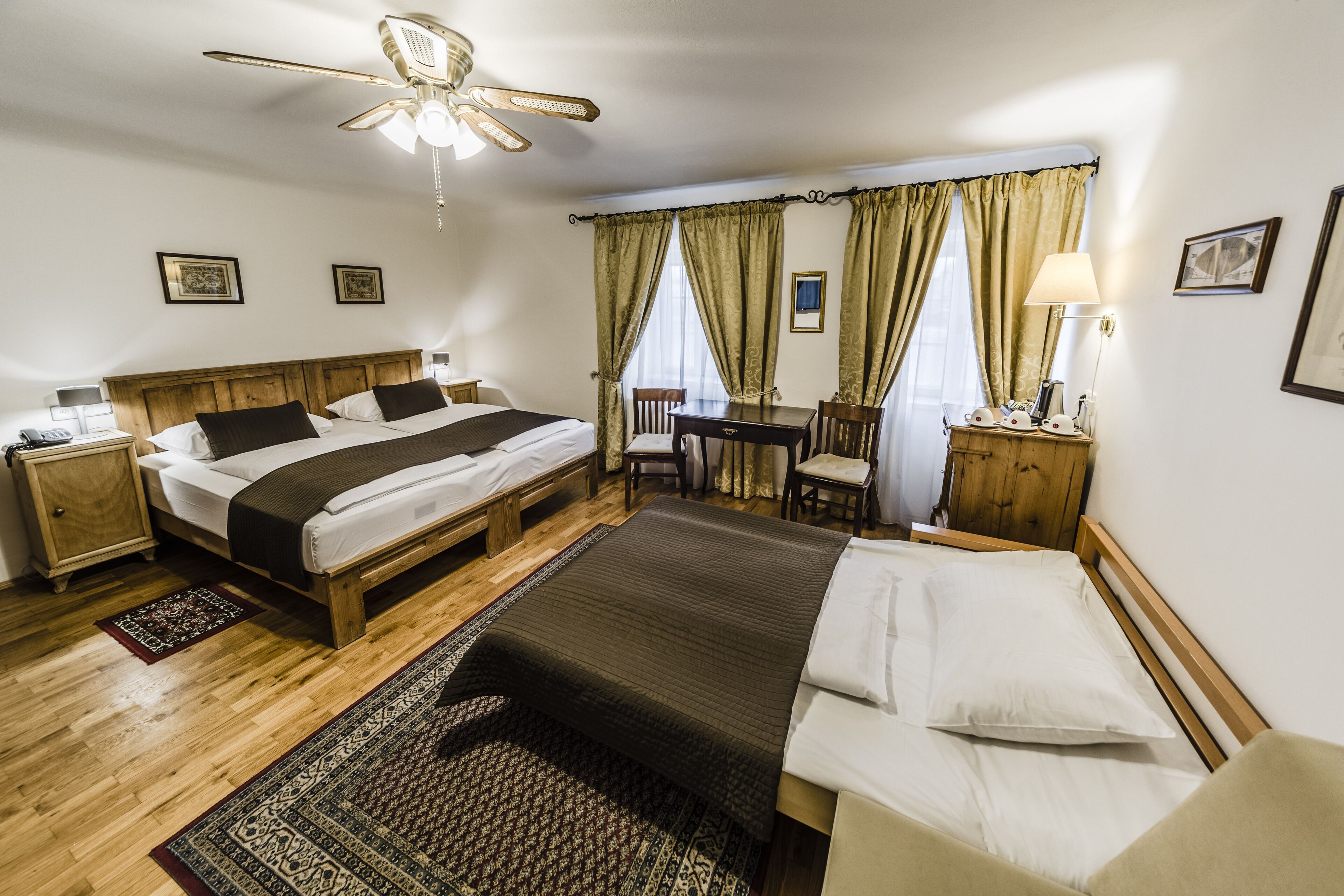 standard triple room, river view | 1 bedroom, in-room safe, desk, iron/ironing board