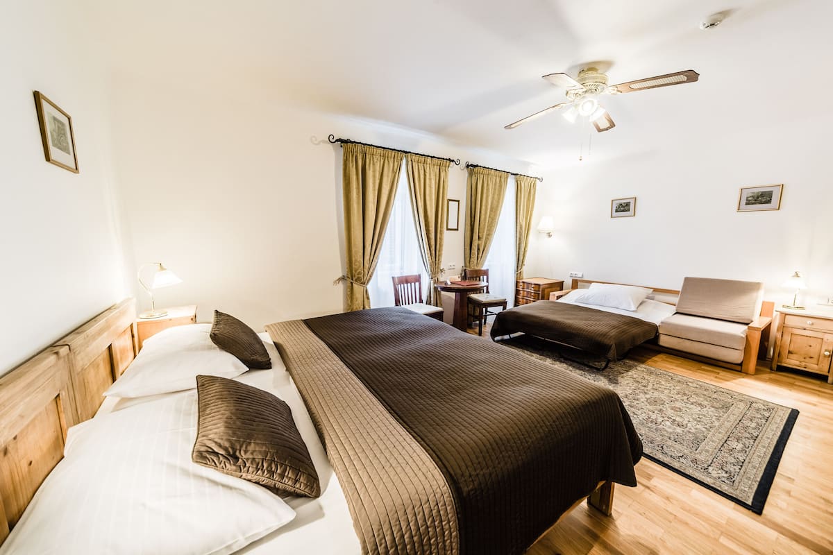 Standard Triple Room, River View | In-room safe, desk, iron/ironing board, free WiFi