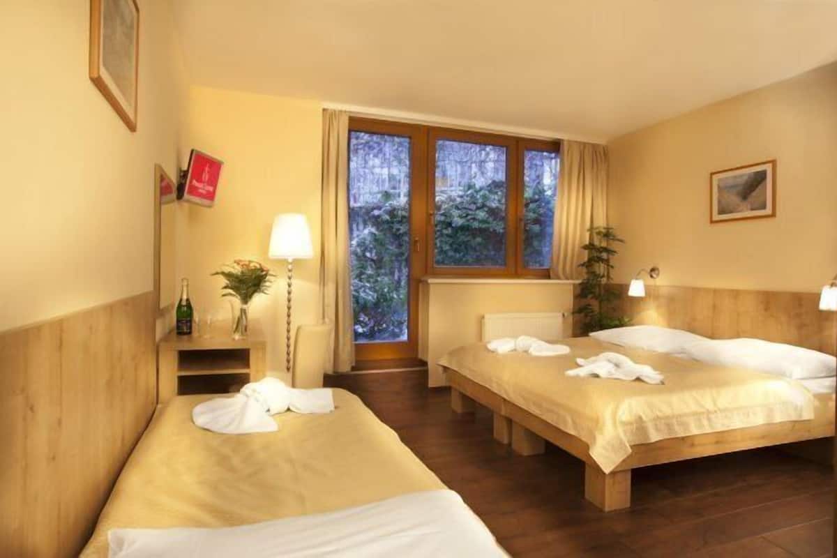 Standard Triple Room | Minibar, in-room safe, desk, laptop workspace