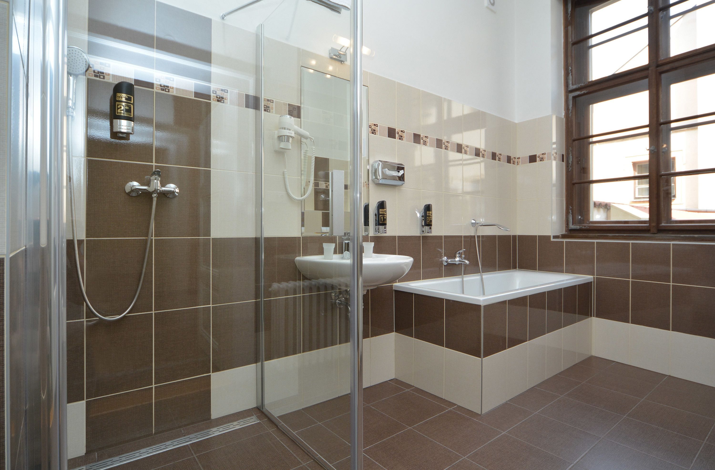 triple room | bathroom | rainfall showerhead, free toiletries, hair dryer, towels