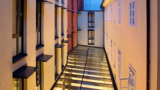 A narrow corridor with glass flooring leading to a staircase. - Hotel Roma Prague (Prague)