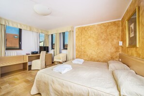 Premium bedding, down comforters, minibar, in-room safe
