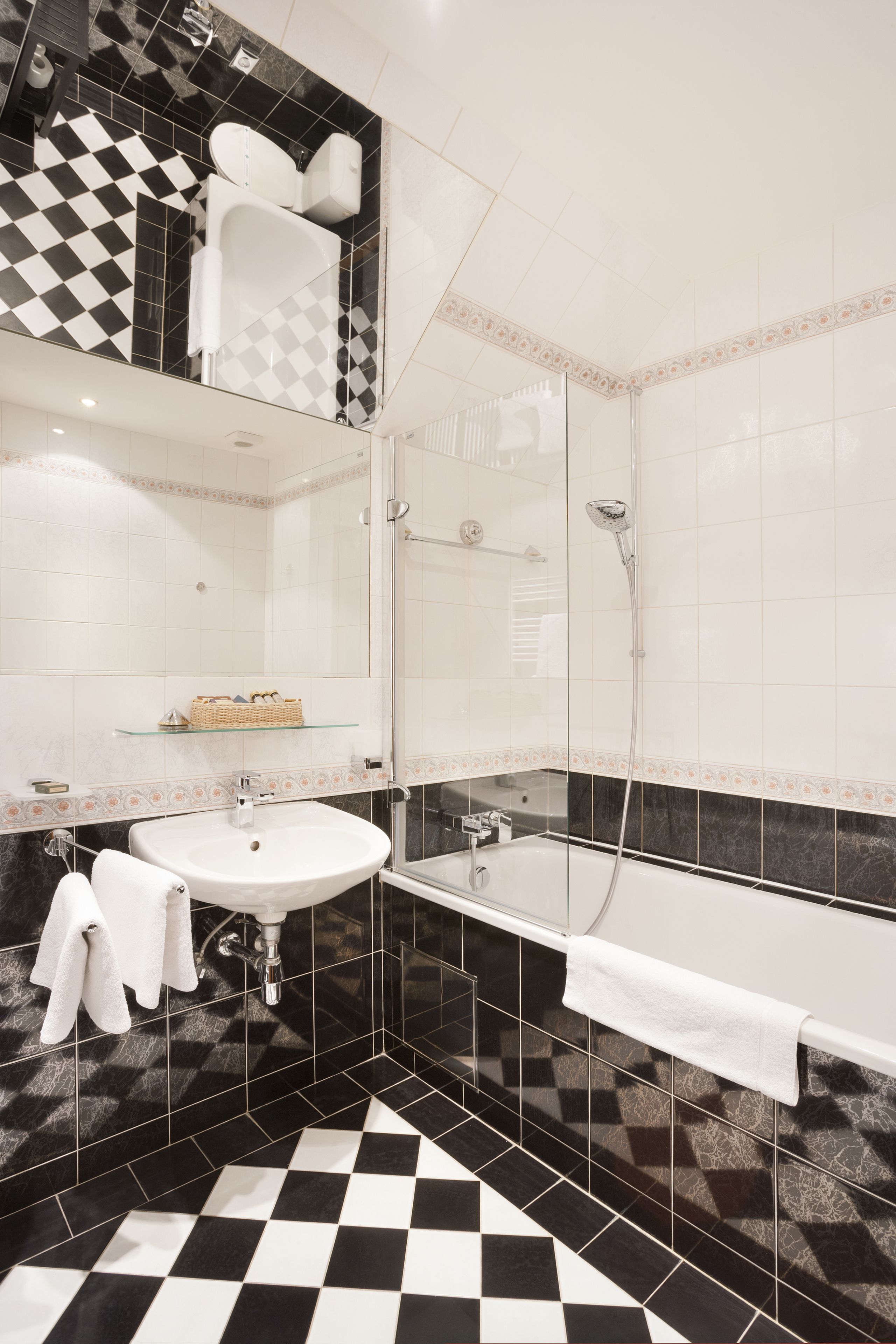 combined shower/bathtub, designer toiletries, hair dryer, slippers