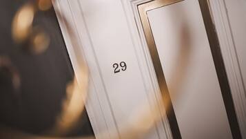 A close-up of a white door with the number 29.