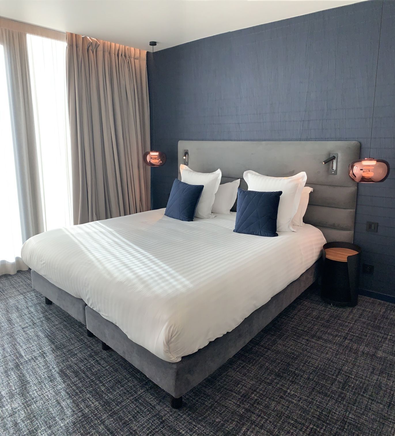 Italiaanse Frette-lakens, luxe beddengoed, pillowtop-bedden, een minibar