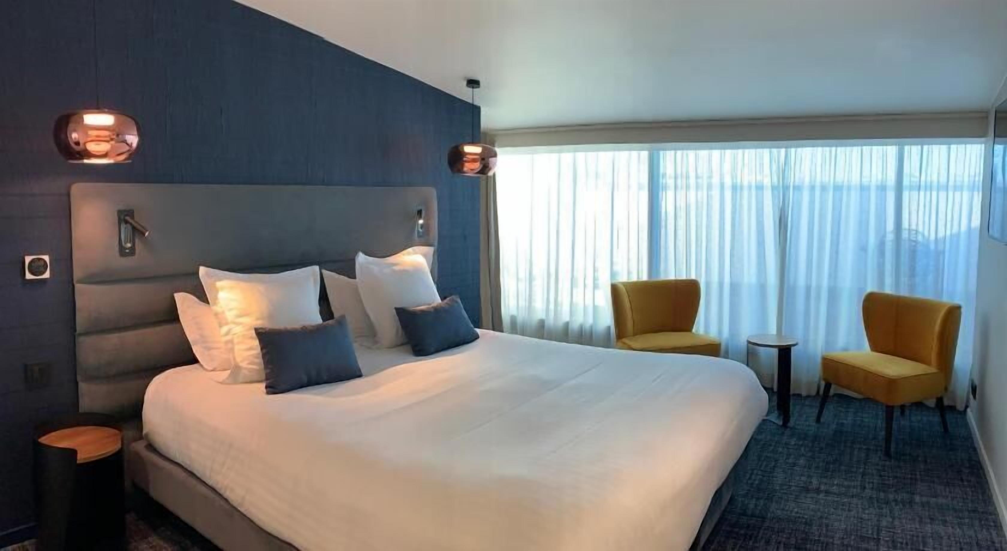 Italiaanse Frette-lakens, luxe beddengoed, pillowtop-bedden, een minibar