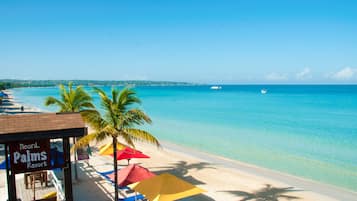 On the beach, sun loungers, beach umbrellas, beach towels