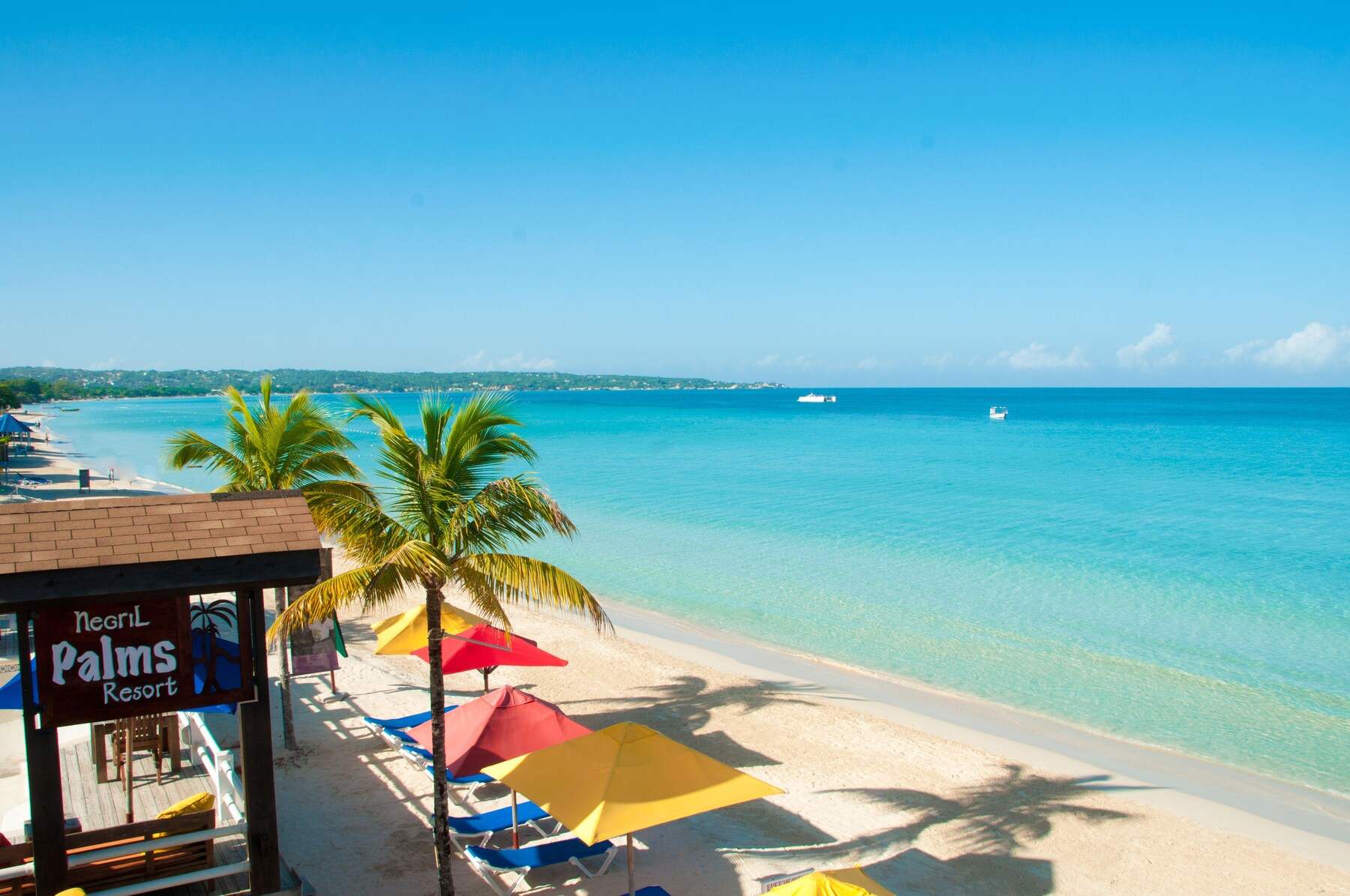 On the beach, sun-loungers, beach umbrellas, beach towels