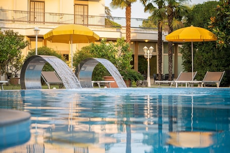 Indoor pool, 3 outdoor pools, open 8:00 AM to 7:00 PM, pool umbrellas