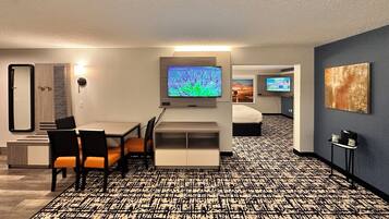 Suite, 1 King Bed, Non Smoking, Refrigerator & Microwave (Larger Room;with Sofabed) | Living area | 54-inch flat-screen TV with satellite channels, streaming services