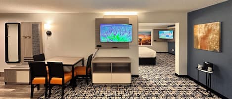 Suite, 1 King Bed, Non Smoking, Refrigerator & Microwave (Larger Room;with Sofabed) | Living area | 50-inch flat-screen TV with satellite channels, streaming services