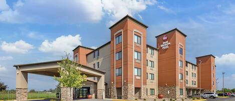 A Best Western Plus hotel with a covered entrance, multiple floors, and a parking lot.