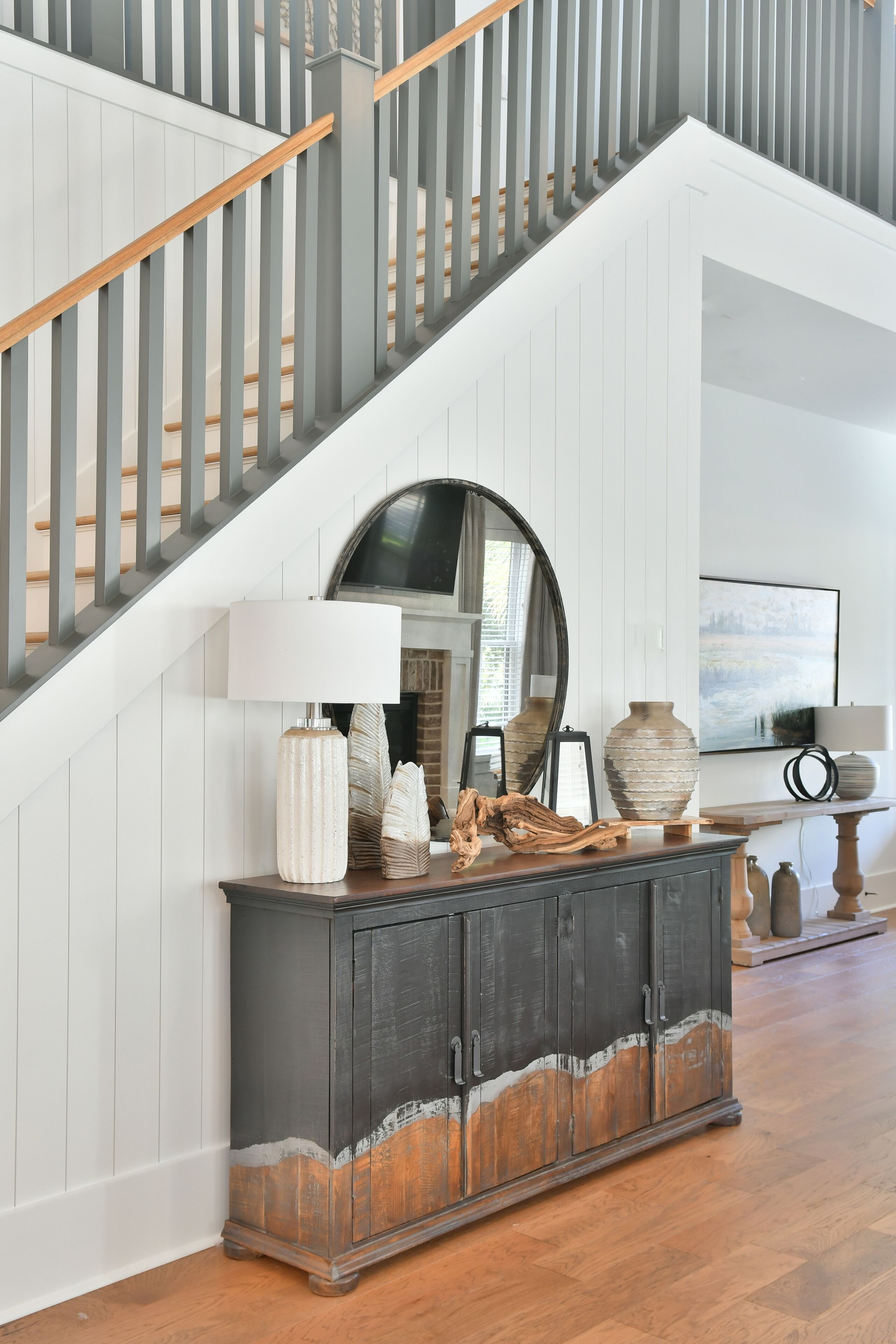 A staircase with wooden steps and a gray railing.