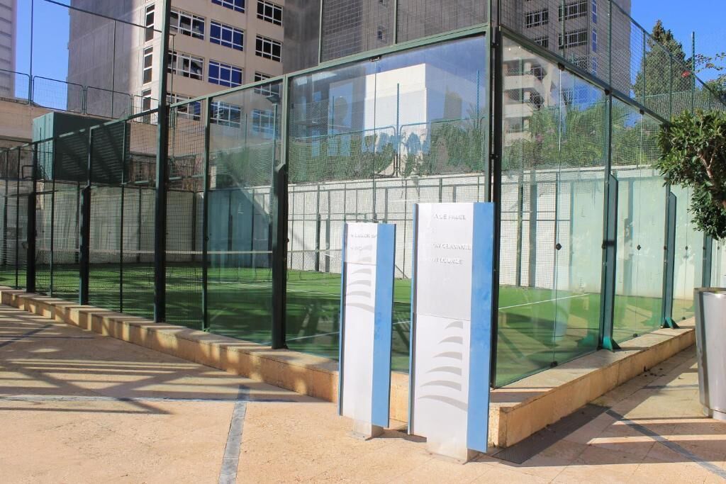 A modern glass enclosure with metal railings, likely a viewing area or a part of a larger structure.