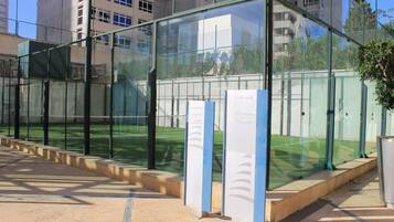 A modern glass enclosure with metal railings, likely a viewing area or a part of a larger structure.