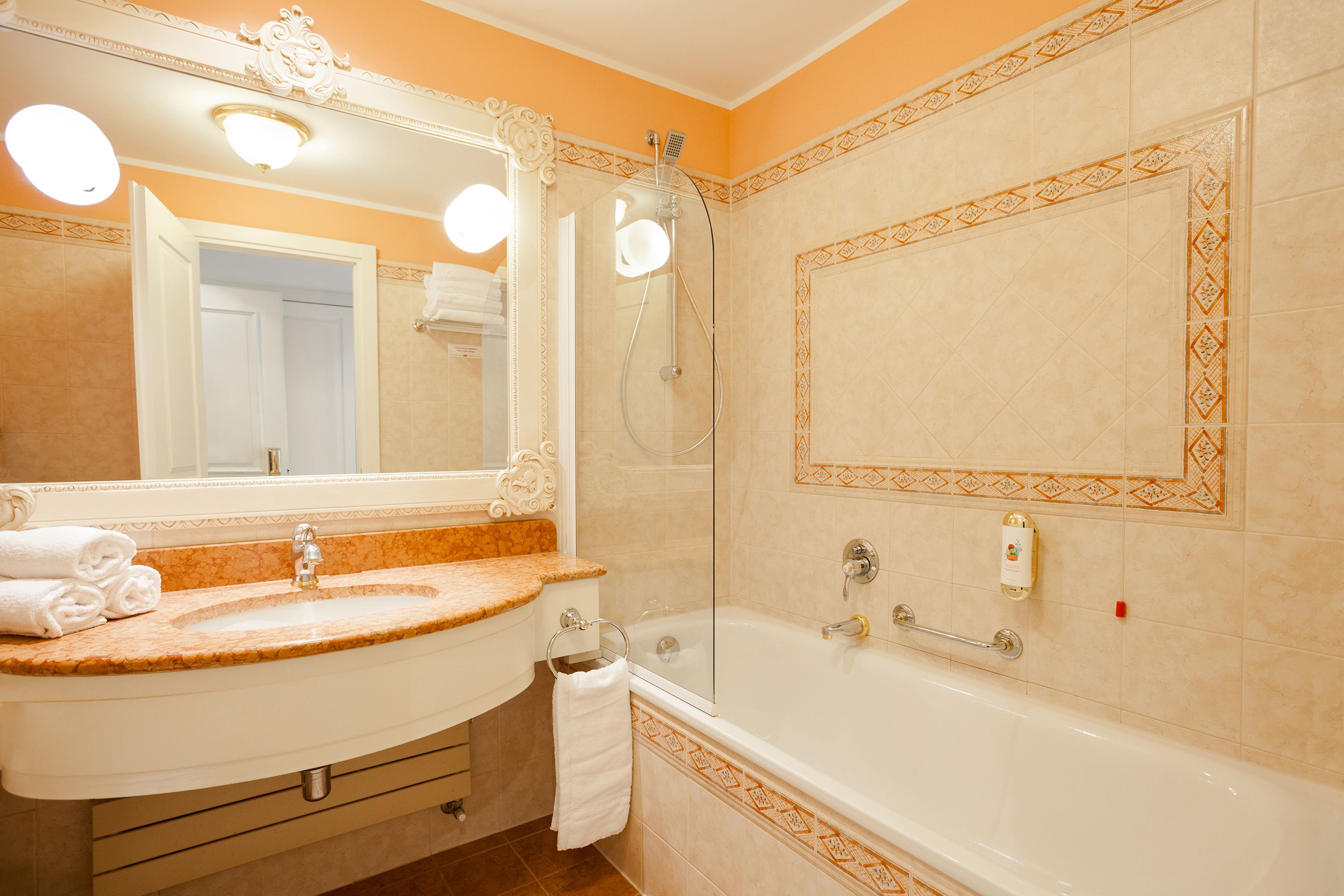 deep-soaking bathtub, hair dryer, bathrobes, towels