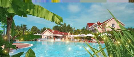 A resort with a swimming pool, a building with a red roof, and tropical vegetation.