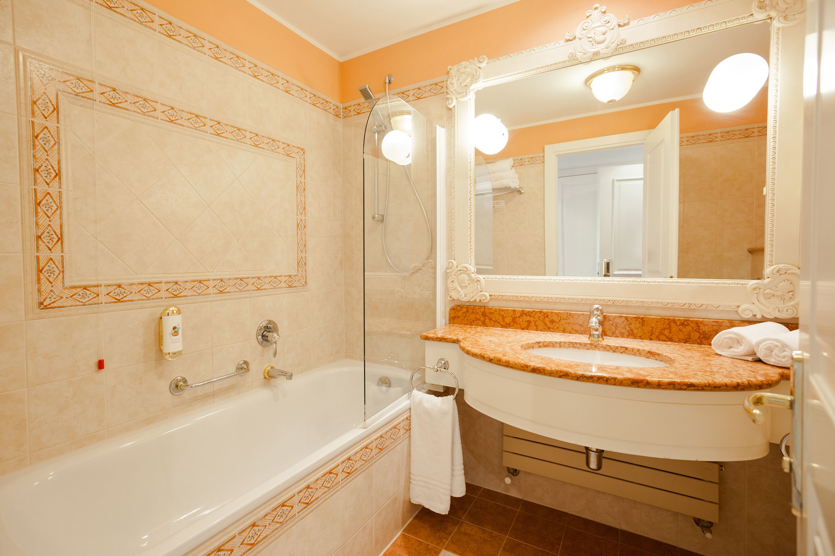 deep-soaking bathtub, hair dryer, bathrobes, towels