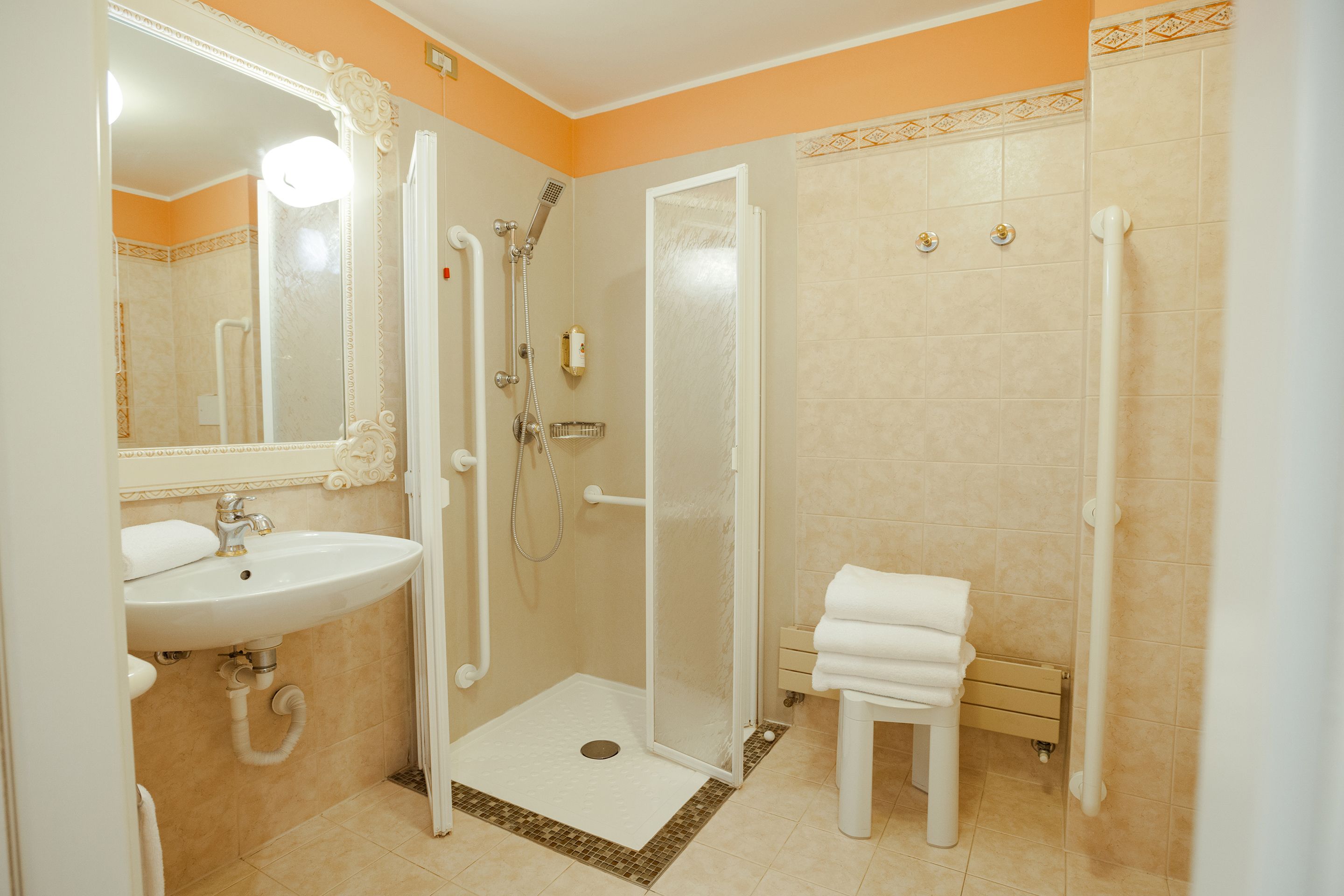 deep-soaking bathtub, hair dryer, bathrobes, towels