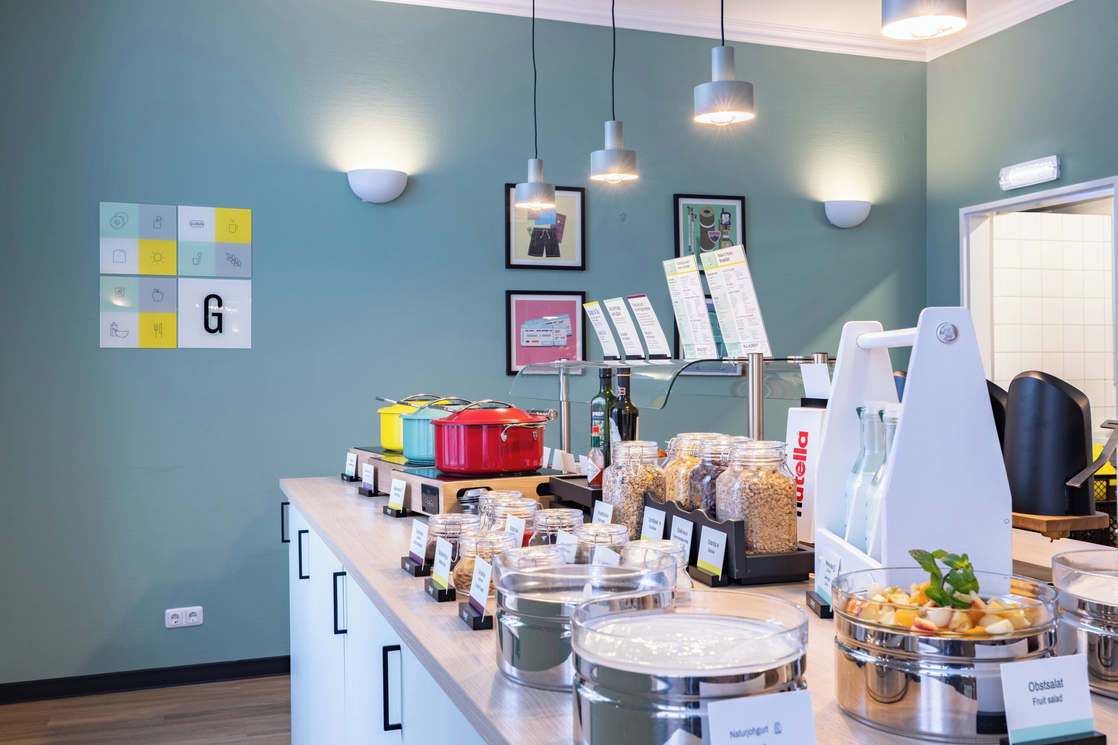 A buffet area with various food items and a menu stand.