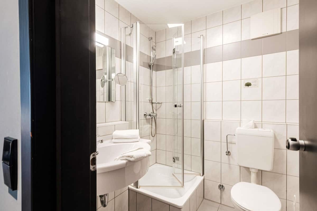 Shower, eco-friendly toiletries, hair dryer, towels
