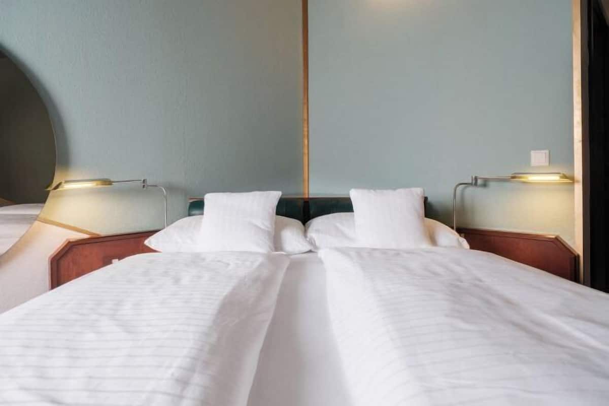 Hypo-allergenic bedding, desk, laptop workspace, iron/ironing board