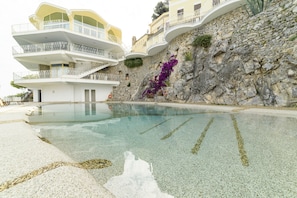 Outdoor pool, open 9:00 AM to 6:00 PM, pool umbrellas, sun loungers