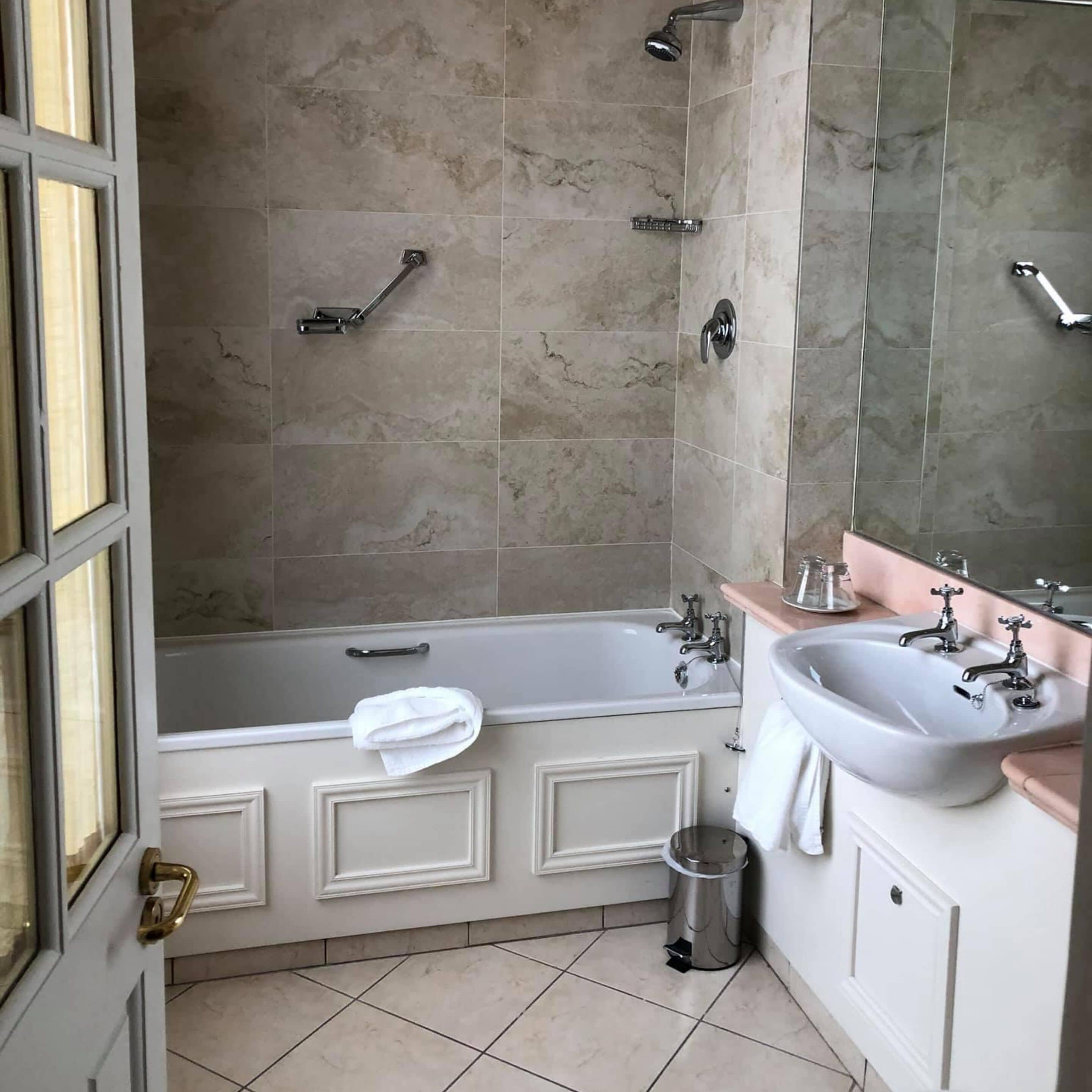 combined shower/bathtub, free toiletries, bathrobes, towels