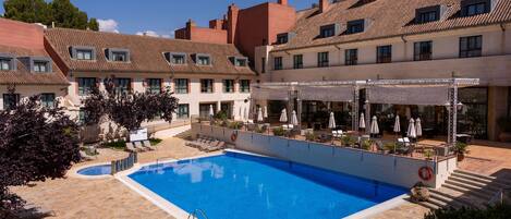 Outdoor pool, open 11:00 AM to 8:00 PM, pool umbrellas, pool loungers