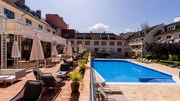 Outdoor pool, open 11:00 AM to 8:00 PM, pool umbrellas, sun loungers