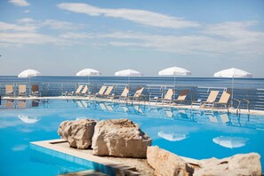 Indoor pool, seasonal outdoor pool, pool umbrellas, sun loungers
