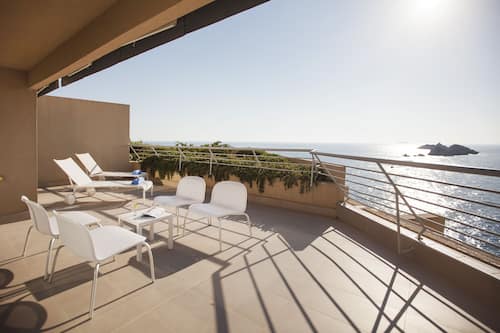 Deluxe Suite, Balcony, Sea View | Minibar, in-room safe, desk, laptop workspace