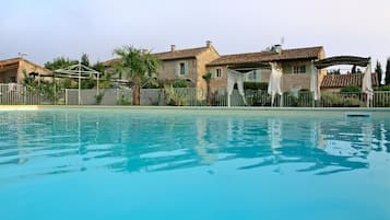 Seasonal outdoor pool, pool umbrellas, pool loungers