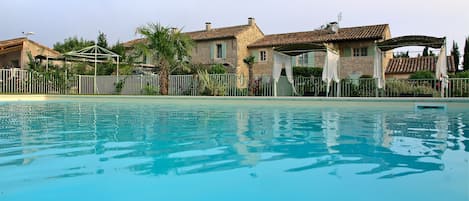 Seasonal outdoor pool, pool umbrellas, pool loungers