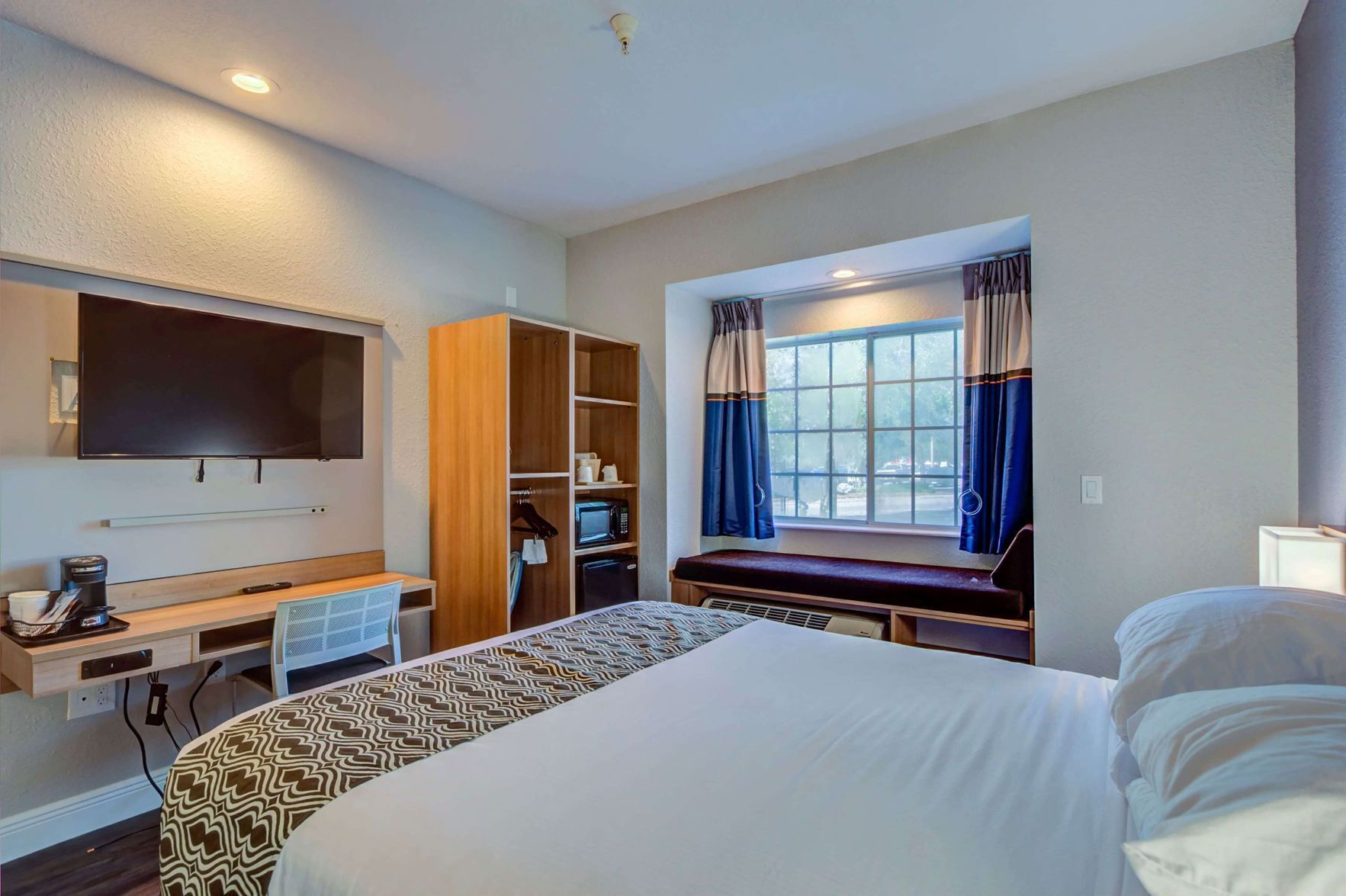Premium bedding, desk, blackout drapes, iron/ironing board