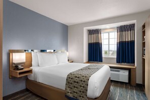 Premium bedding, desk, blackout drapes, iron/ironing board - Microtel Inn & Suites by Wyndham Zephyrhills (Zephyrhills)