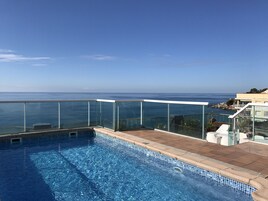 Outdoor pool, pool umbrellas, pool loungers