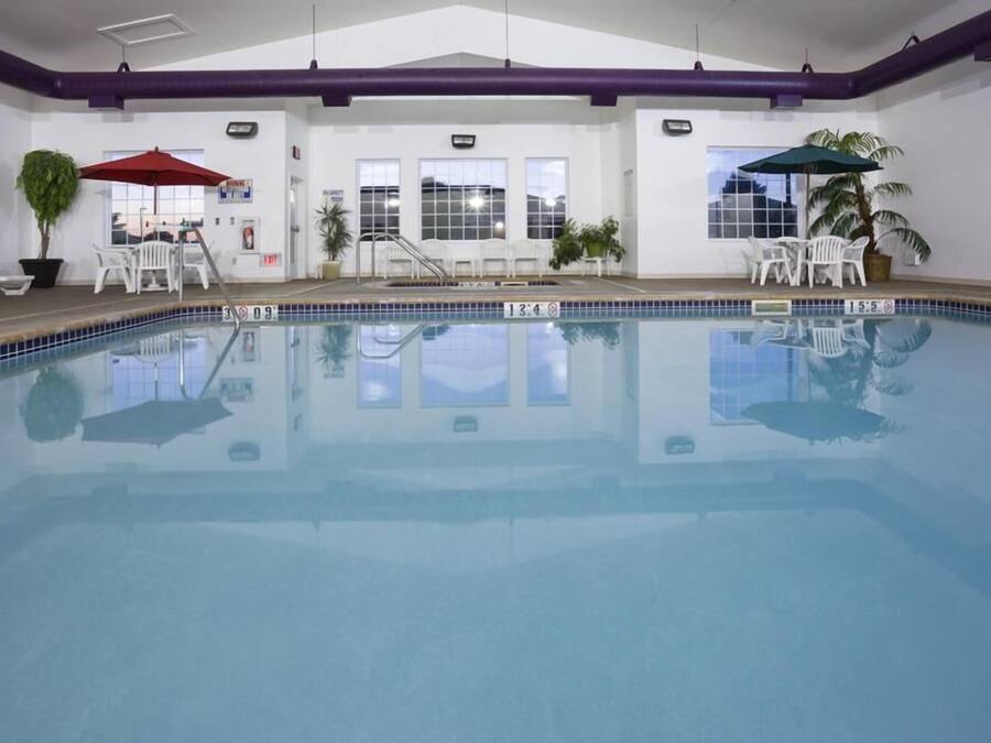 Indoor pool, open 6:00 AM to 11:00 PM, pool umbrellas
