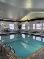 Indoor pool, open 6:00 AM to 11:00 PM, pool umbrellas