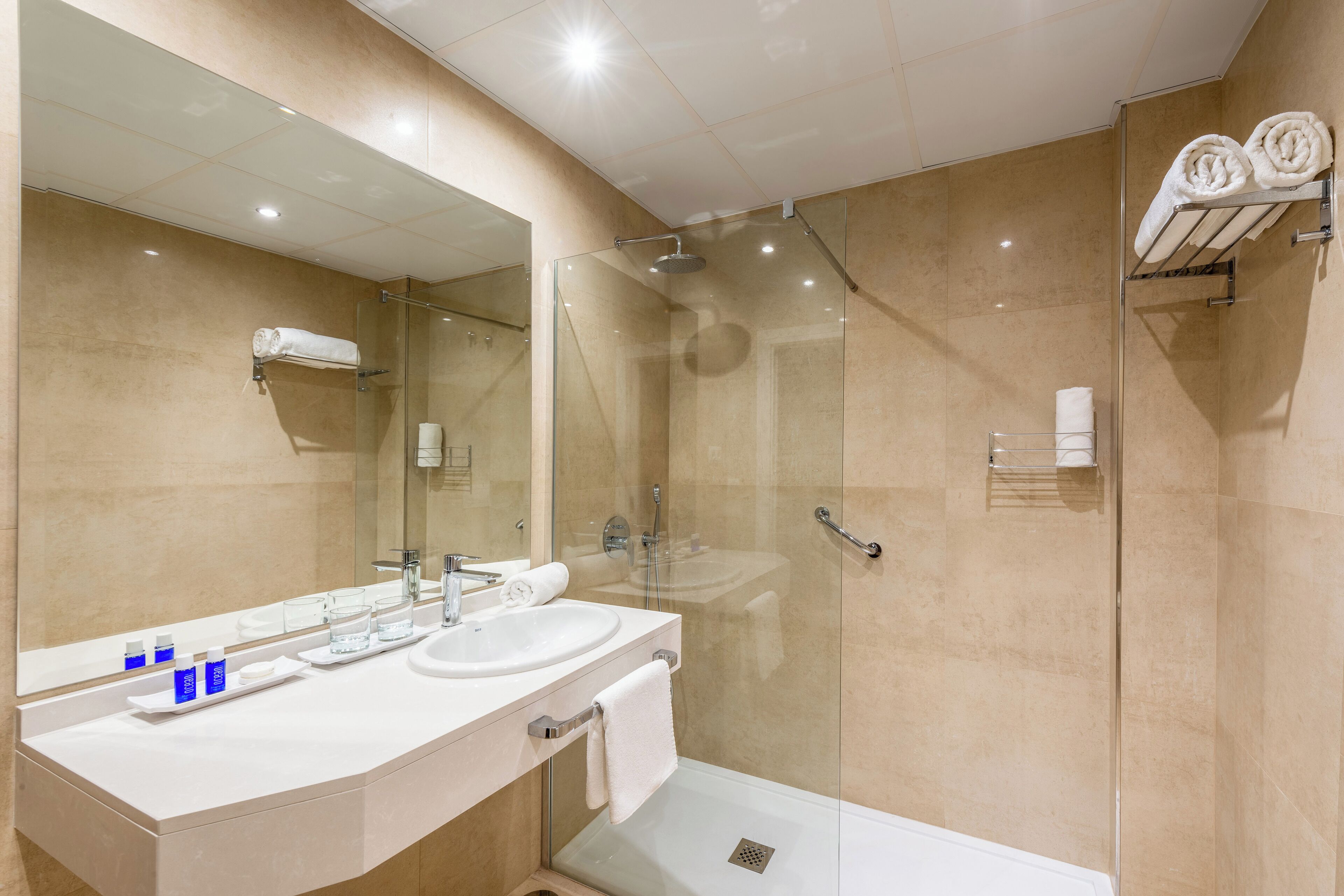 designer toiletries, hair dryer, towels, soap