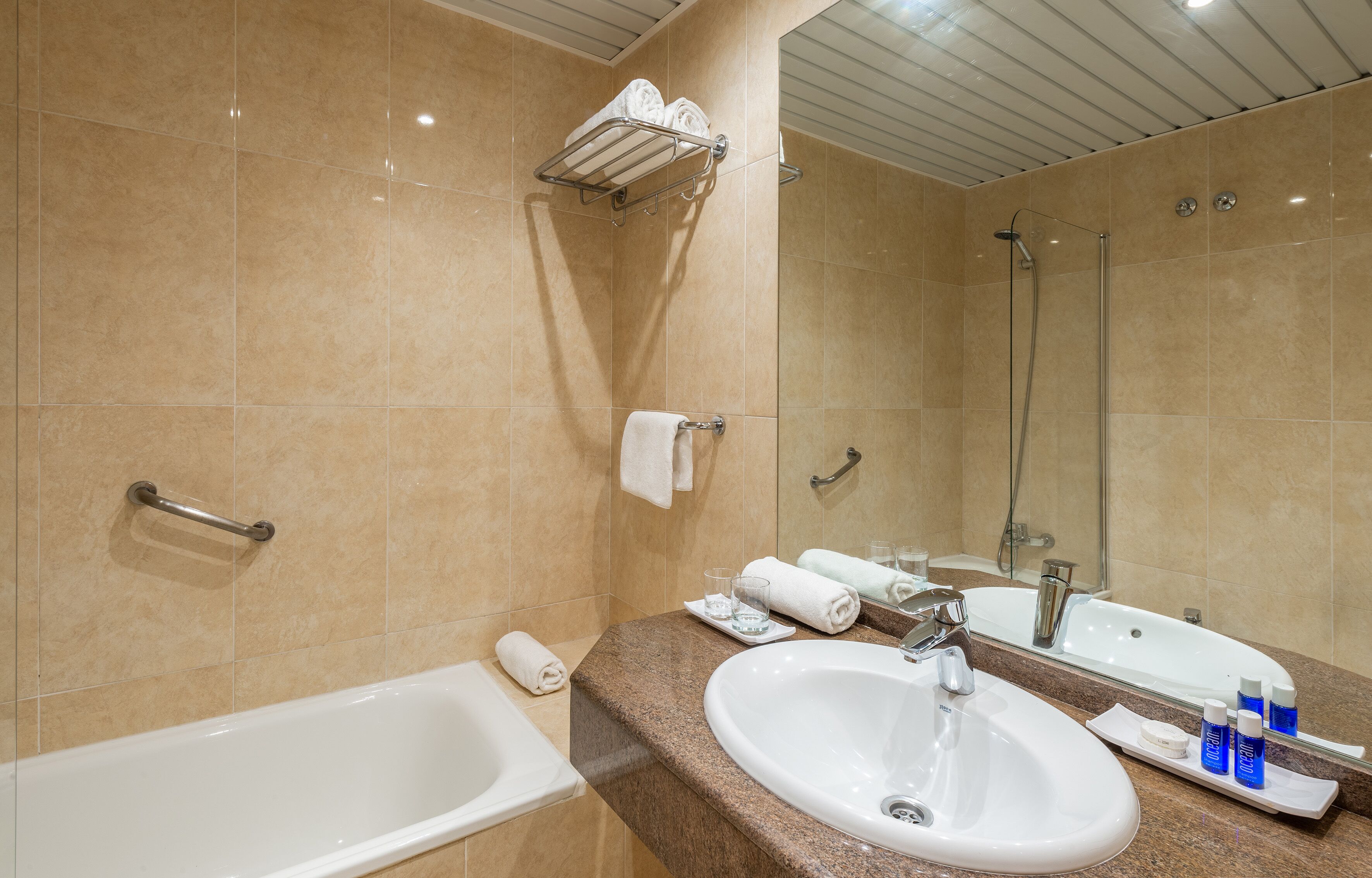 designer toiletries, hair dryer, towels, soap