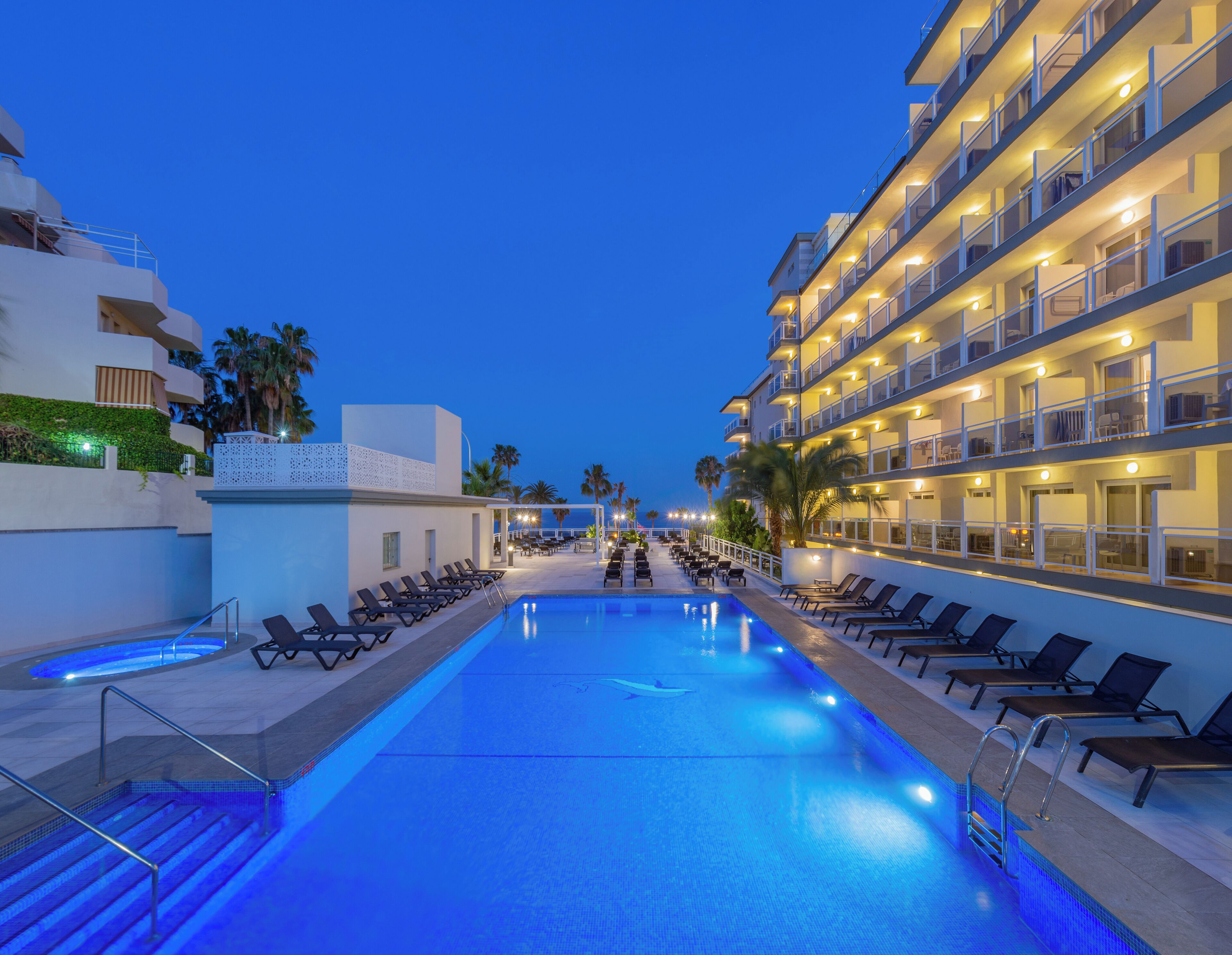 outdoor pool, pool umbrellas, pool loungers