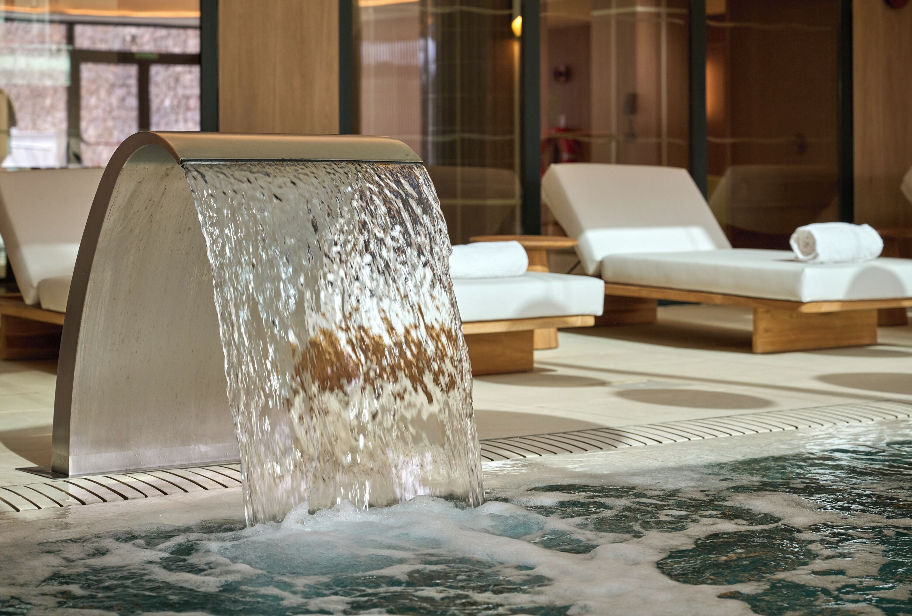 Indoor pool, outdoor pool, pool umbrellas, pool loungers
