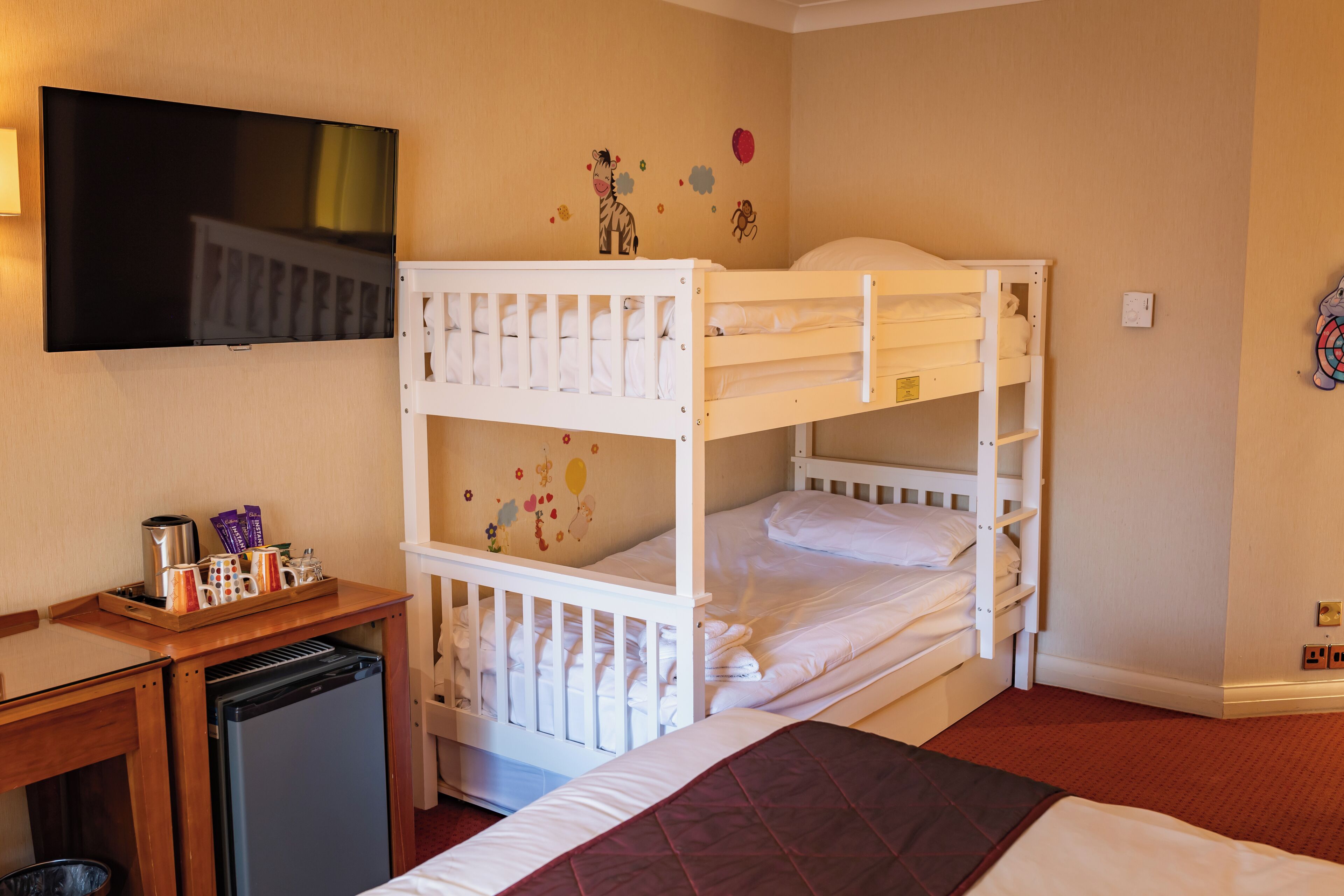 Family Room | Premium bedding, in-room safe, desk, iron/ironing board