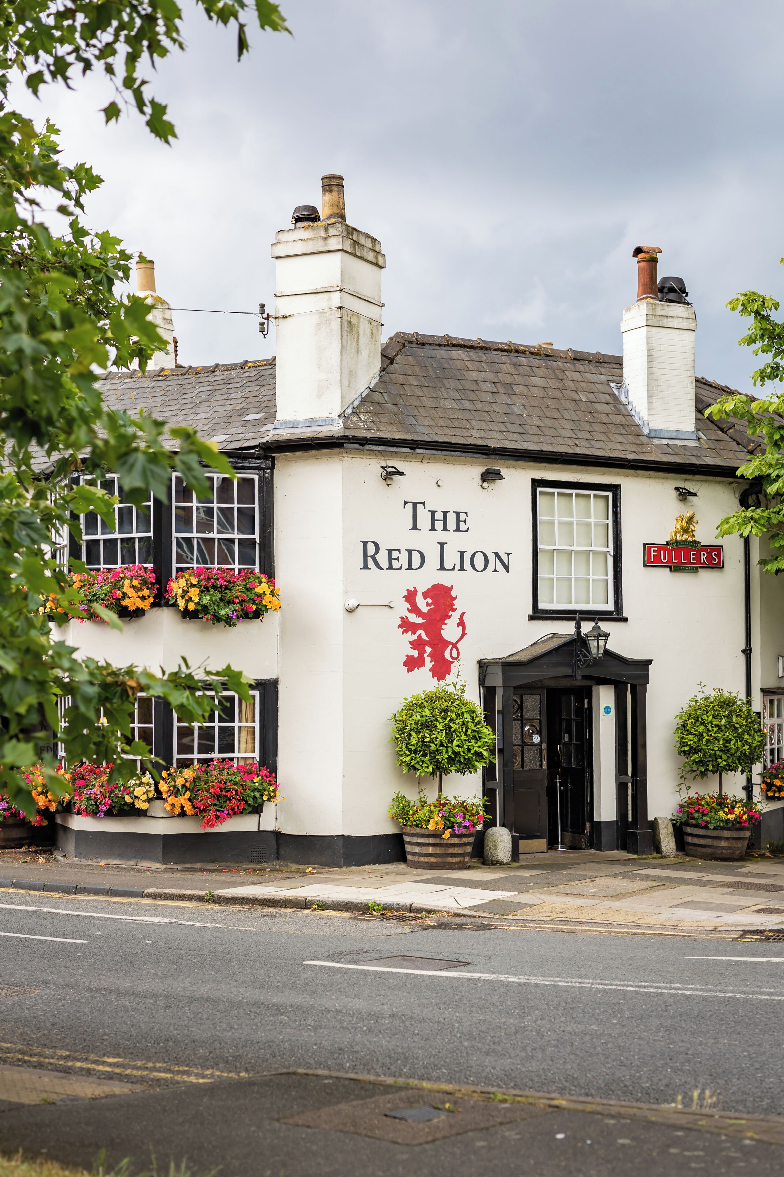 A building with a sign reading "The Red Lion."