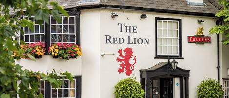 A building with a sign reading "The Red Lion."